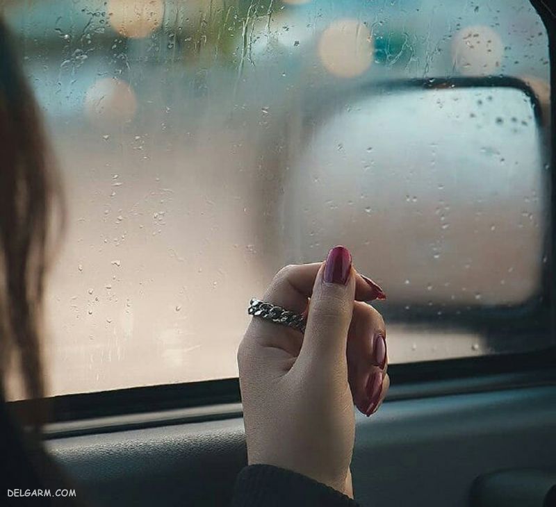 عکس دختر پشت شیشه بارانی