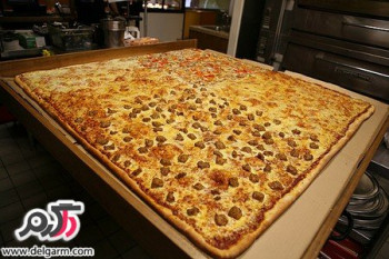 تصاویری از پخت بزرگترين پيتزای جهان
