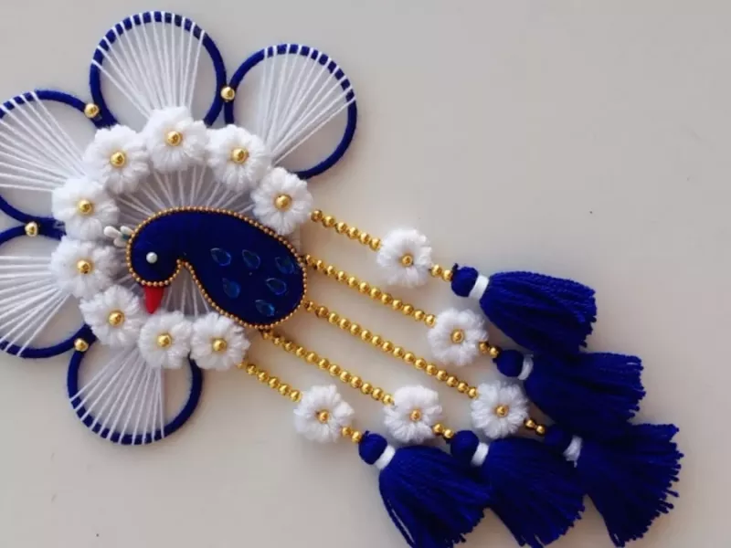 ساخت دیوارکوب به شکل طاووس با نخ کاموایی !